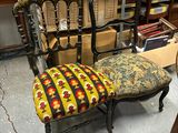a chair that is sitting in front of a pile of boxes