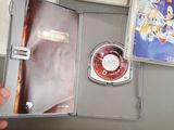 a person holding a nintendo wii game in a case