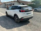 a white car parked on the side of the road