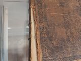 an old book hanging from the ceiling in a room