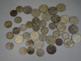 a lot of coins that are on the table