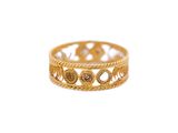 a close up of a gold ring on a white background