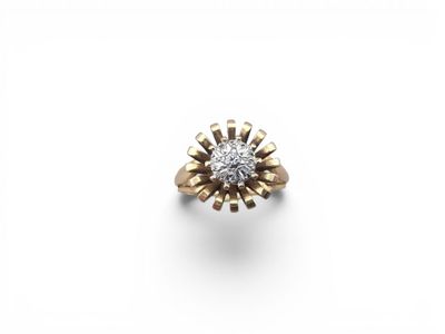 an 18k yellow gold and diamond ring