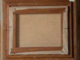 an old picture of a picture frame in a wooden frame