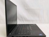 laptop computer sitting on a white surface with a white background
