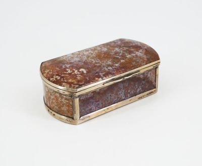 an image of a silver and brown box on a white surface
