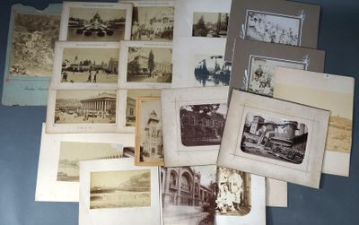 many old photographs of people and buildings on the table