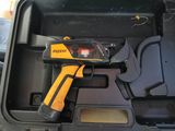 a yellow and black gun in a black case