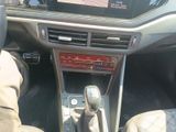 a close up of a car ' s dashboard with a steering control