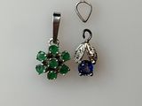 pair of blue and green earrings on a white surface