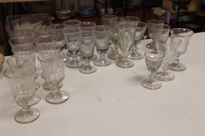 a lot of empty wine glasses sitting on a table