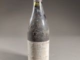 a bottle of wine that is sitting on a table