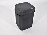 a small black case sitting on a white surface