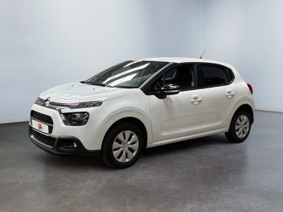 a white citrole car parked in a white room
