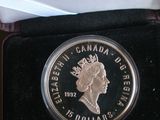 the coin is in a black box with a gold medal