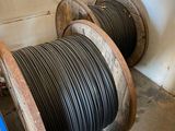 two reels of wires on a shelf in a room