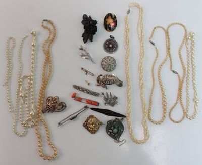 a lot of jewelry that is laying out on the table