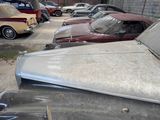 many old cars that are parked in a parking lot