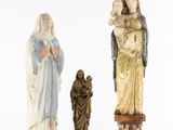 three figurines of jesus, mary, and jesus on a white background