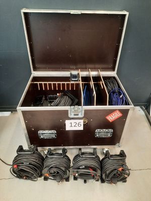 a suitcase with a bunch of cables inside of it