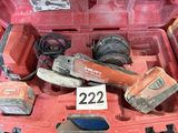 a red car with tools in the trunk of it