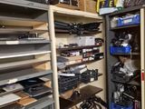 a room filled with lots of electronics on shelves