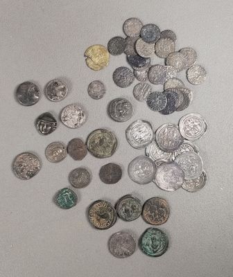 a lot of coins that are on the table
