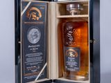 a bottle of whisky in a wooden box with a label on it