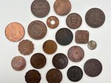 a bunch of coins sitting on top of a white surface