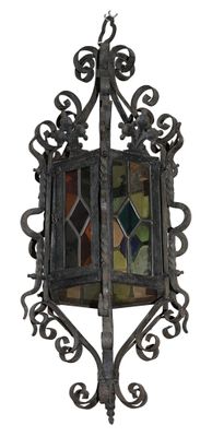wrought iron hanging light fixture with stained glass panels
