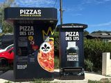 a pizza kiosk that has a panda face on it