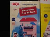 two boxes of haba toys on a black background