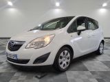 a picture of a white opel parked in a showroom