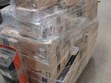 a large stack of boxes sitting on a pallet in a warehouse