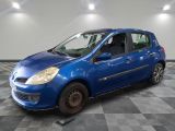 a blue car is parked on a checkered floor in a garage