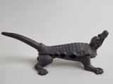 an image of a dog figurine made out of iron