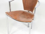 a wooden chair with a metal frame on a white background