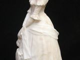 a statue of a woman in a white dress