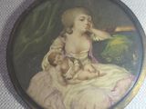 painting of a woman holding a baby in her lap