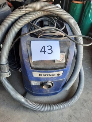 a blue vacuum with a hose and a number 43 on it