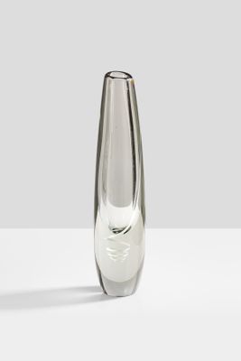 a glass vase that is sitting on a table