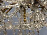 a chandelier made of glass beads hanging from the ceiling