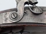 a close up of a gun that is on display