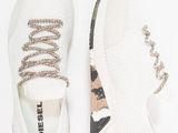 a close up of a pair of white sneakers on a white background