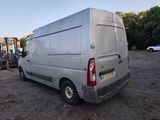 a silver van that is parked in a parking lot
