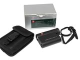an image of a camera with a case and a charger
