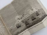 an open book with a picture of a boat in the water