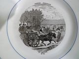 une assiette sur laquelle est représentée une calèche