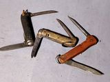 several different types of knives on a table