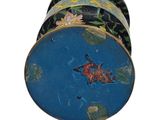 an image of a blue and black box with a butterfly painted on it